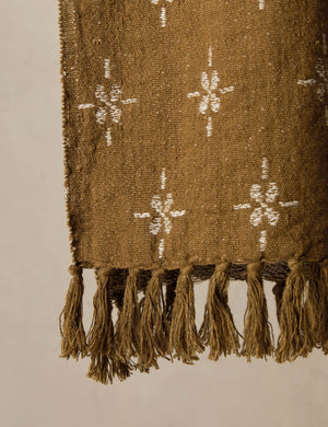 Close up of the fringe of the Fania lightweight linen-cotton blend floral motif throw.