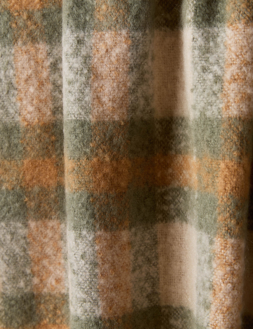 #color::iced-coffee-and-deep-sage | Close up of the Haldar chunky tasseled edge plaid throw.