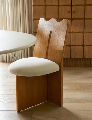 Ripple tall, wavy back wooden dining chair at a table