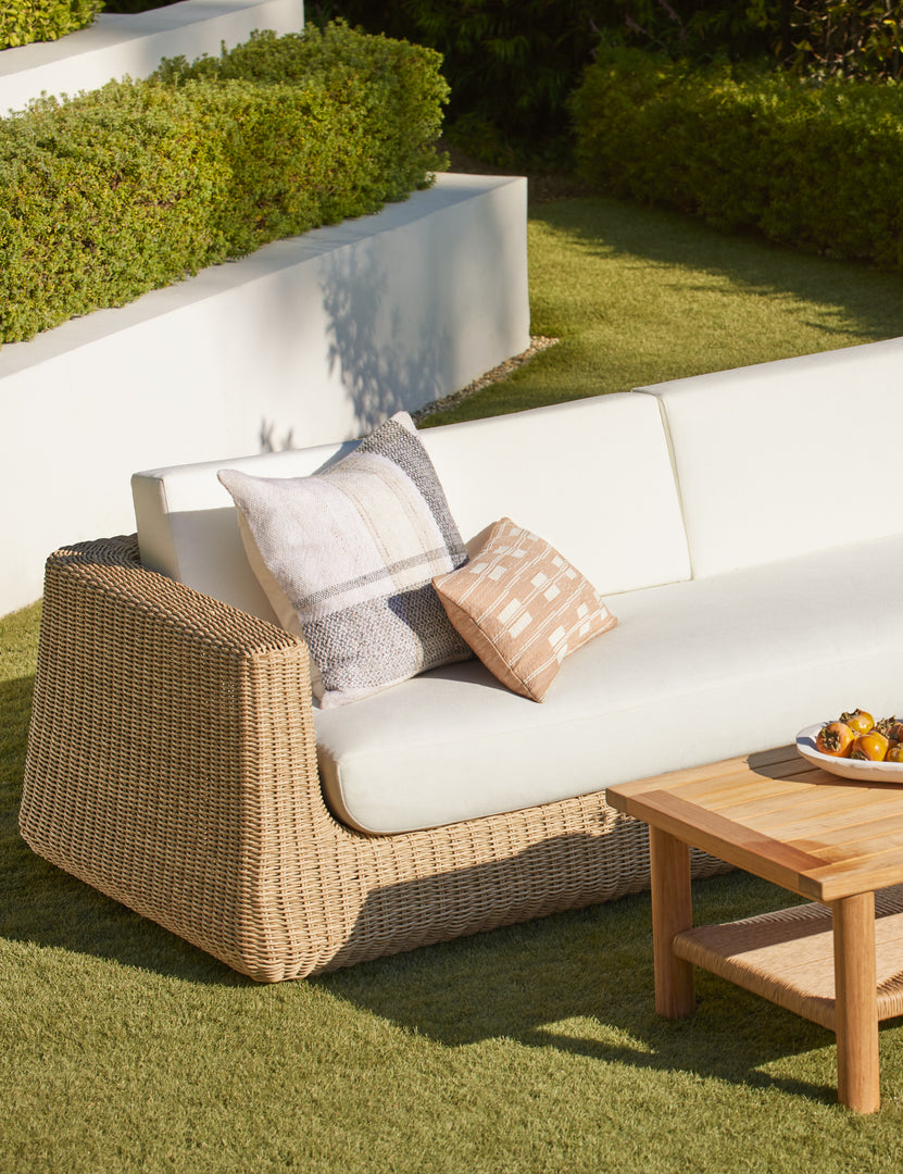 #color::terracotta #style::lumbar | Leighton broken stripe lumbar pillow in terracotta styled on an outdoor sofa.