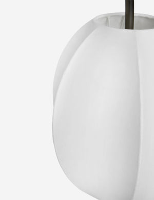 Close up of the Luneth arc-shape lantern shade linear chandelier by Aimee Song