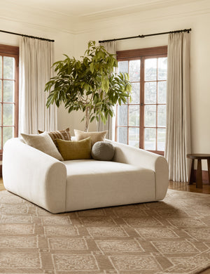 Harlowe softly sculpted plush media lounger styled with textured throw pillows.