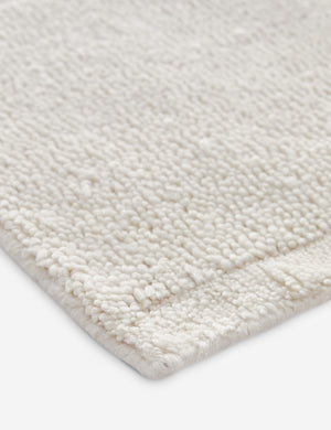 Close up view of the corner of the Malta Hi-Lo Pile Hand-Knotted Wool Rug by Aimee Song