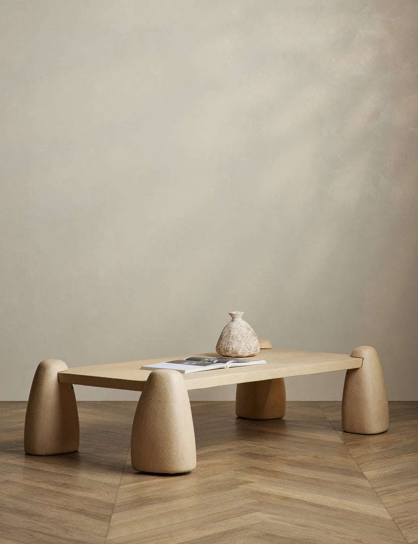 #color::sand | Quarry sculptural concrete coffee table styled with a coffee table book and vase