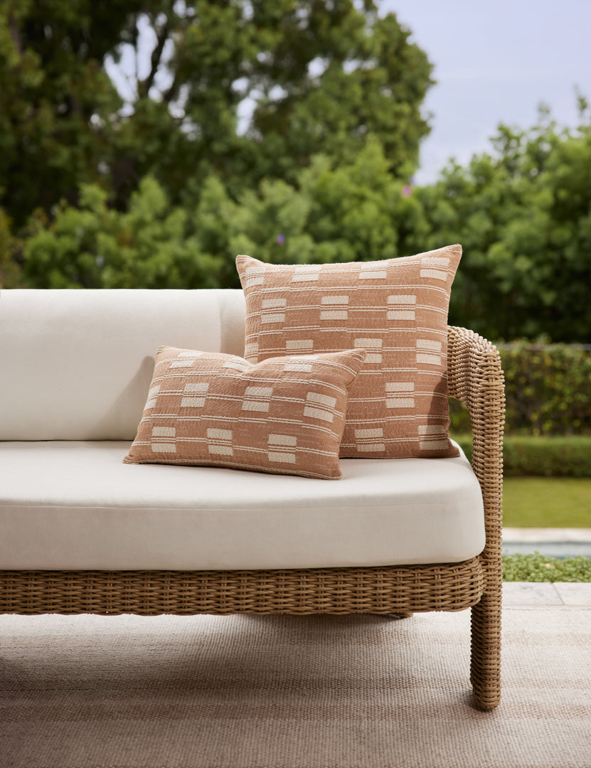 #color::terracotta #style::square #style::lumbar | Both the leighton lumbar pillow and throw pillow in terracotta styled on an outdoor sofa together.