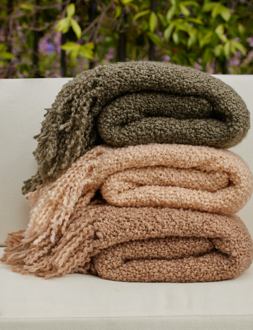 #color::terracotta #color::moss #color::natural | All three colors of the Jaffe chunky knit fringed outdoor throw blanket.
