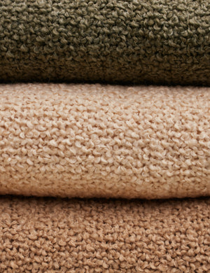 Close up of all three colors of the Jaffe chunky knit fringed outdoor throw blanket.