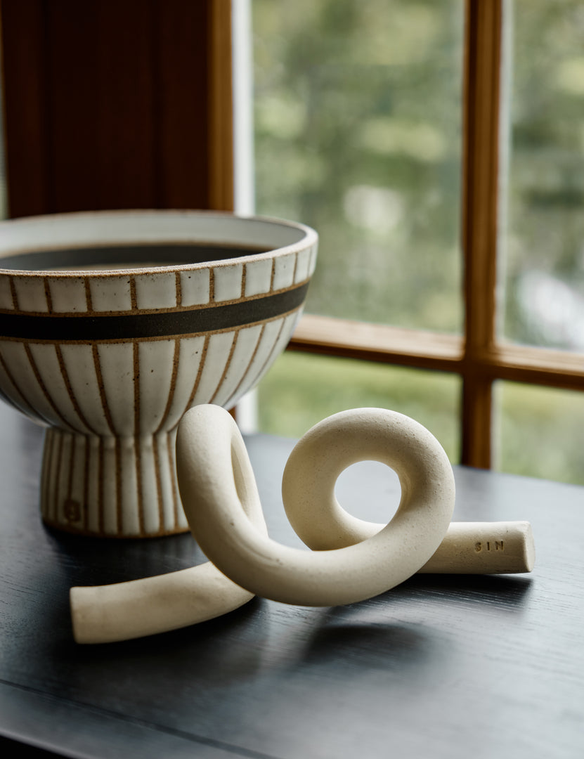 #color::white | Close up view of the decorative ceramic Ollis Knot by SIN Ceramics