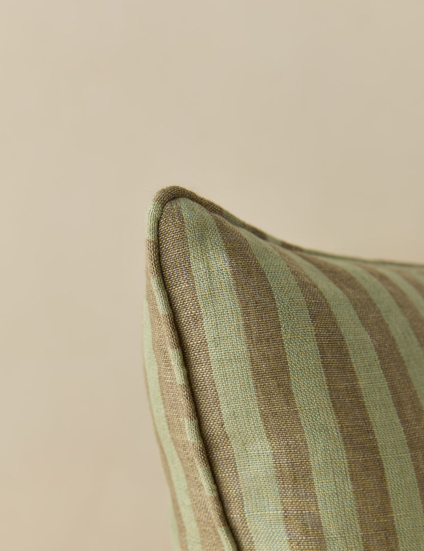 #style::square #style::lumbar #color::hunter | Close up view of the corner of the Welby striped tufted button linen throw pillow by Aimee Song