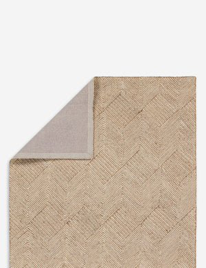 Folded corner of the Brisker handwoven chevron jute rug.