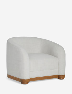 Angled view of the Marci off white low barrel design accent chair