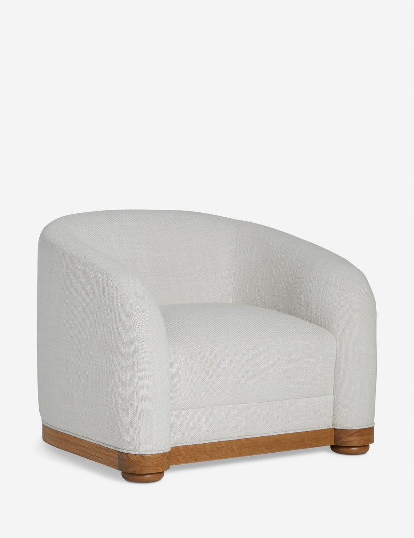 | Angled view of the Marci off white low barrel design accent chair
