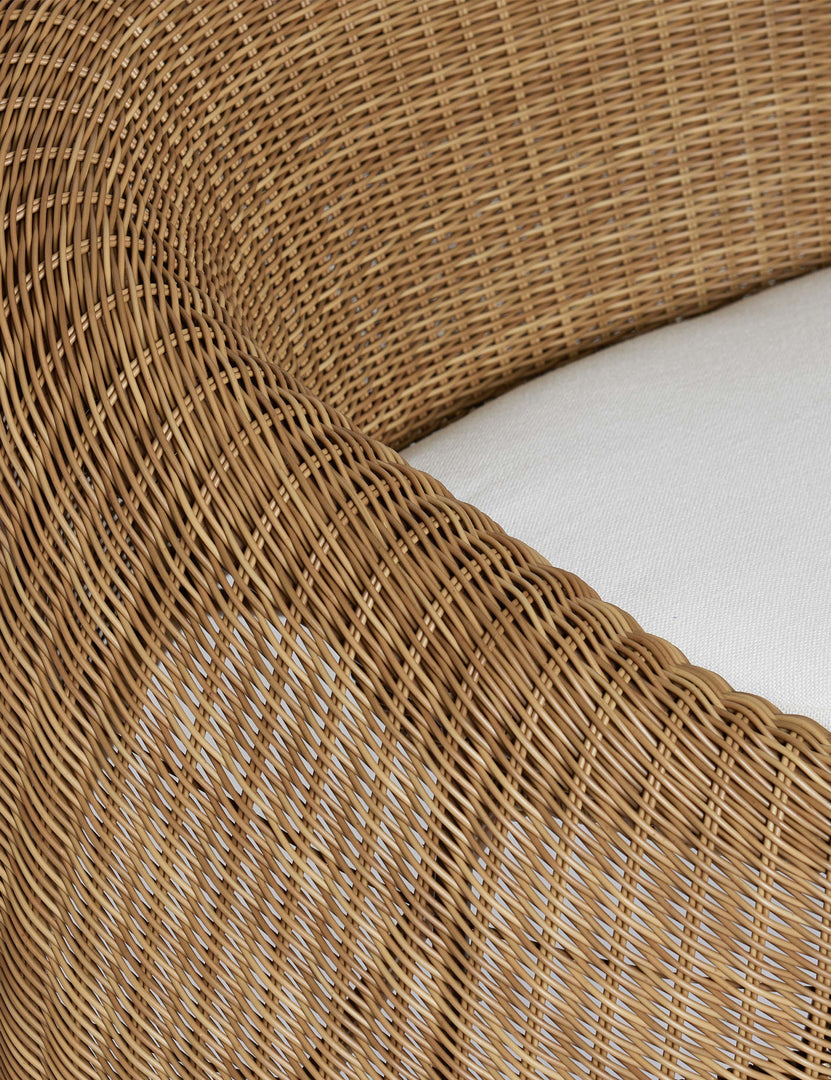#color::natural | Close up of the Marisol sculptural wicker outdoor accent chair.