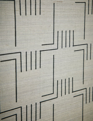Close up view of the patter of the Mesa Grasscloth Wallpaper by Élan Byrd.