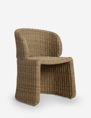 Angled view of the Mettam modern wicker outdoor dining chair.