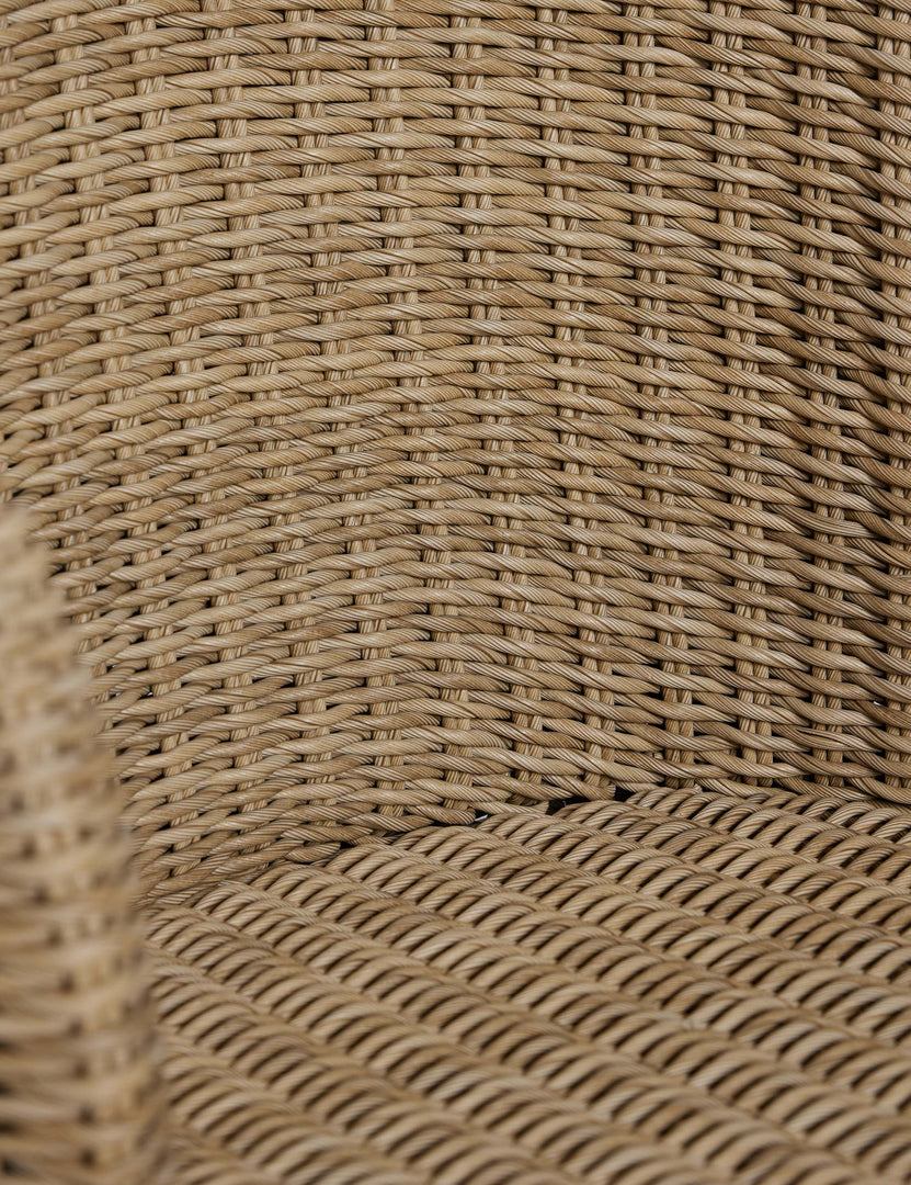 #color::natural | Close up of the back of the Mettam modern wicker outdoor dining chair.