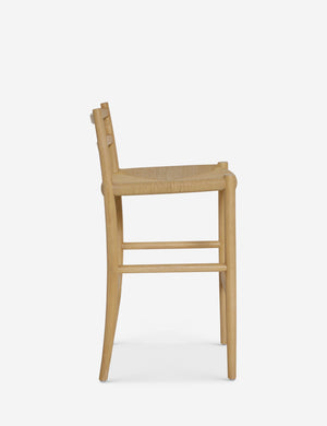 Side view of the Nicholson slim natural oak wood frame and woven seat counter stool.