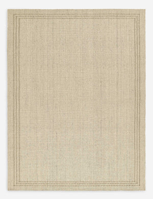 Greco low pile wool rug with accent border stitching.