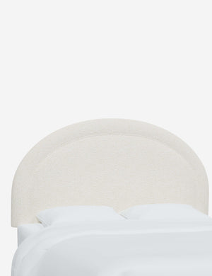 Angled view of the Odele Cream Sherpa arched headboard