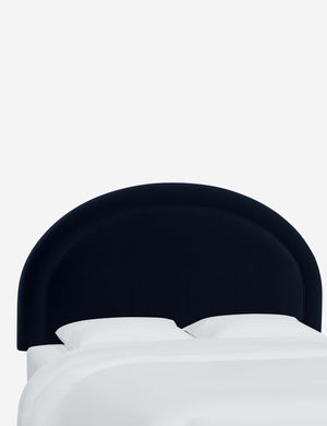 Angled view of the Odele Navy Velvet arched headboard
