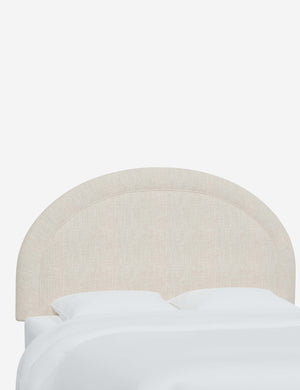 Angled view of the Odele Talc Linen arched headboard