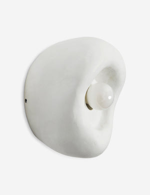 Side view of the Odette round matte white sculptural wall sconce