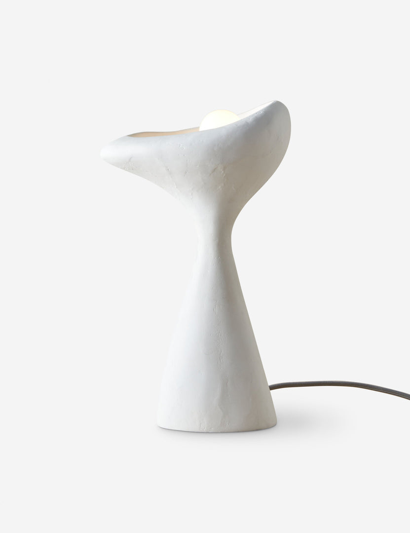 #color::white | Odette matte white sculptural table lamp with light turned on
