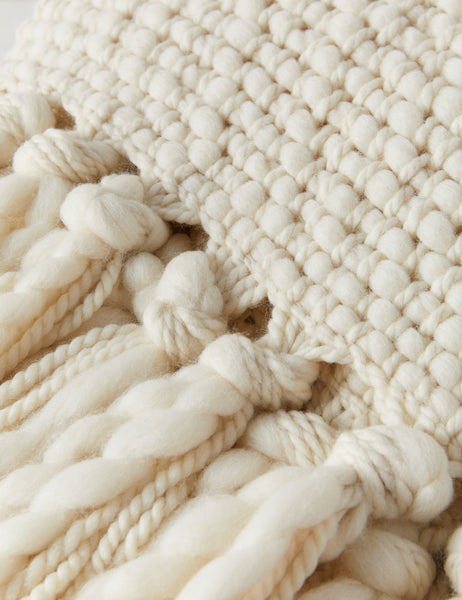 #color::ivory | Close-up of the fringed ends on the Olema ivory handwoven throw