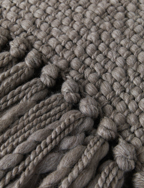 #color::mink | Close-up of the fringed ends on the Olema mink gray handwoven throw