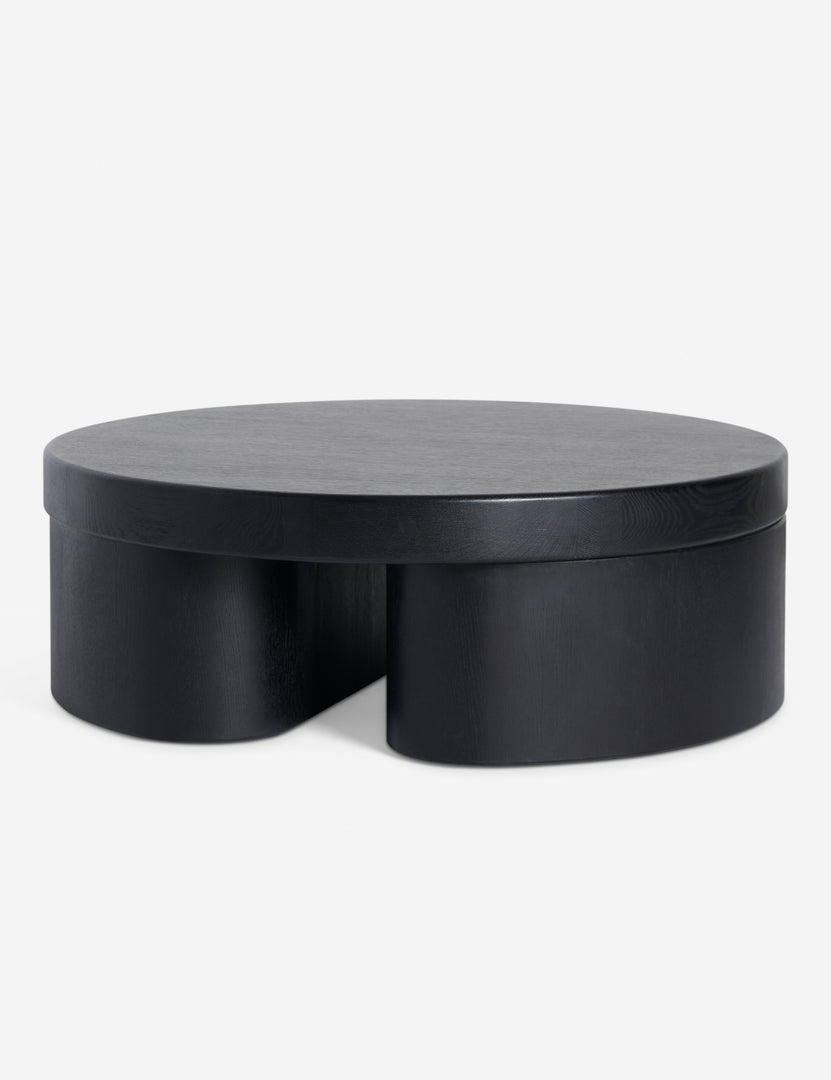 | Angled view of Olga round modern black oak coffee table