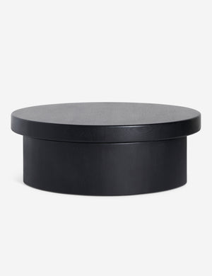 Side view of Olga round modern black oak coffee table