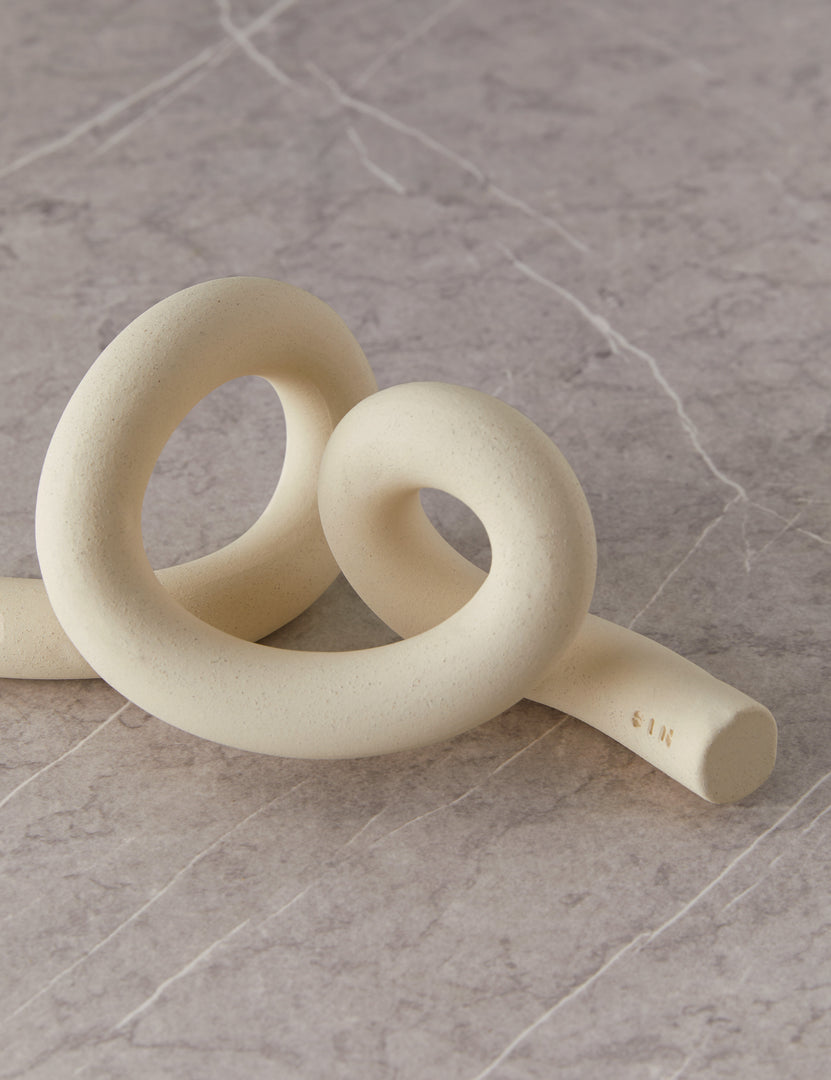 #color::white | Angled view of the decorative ceramic Ollis Knot by SIN Ceramics
