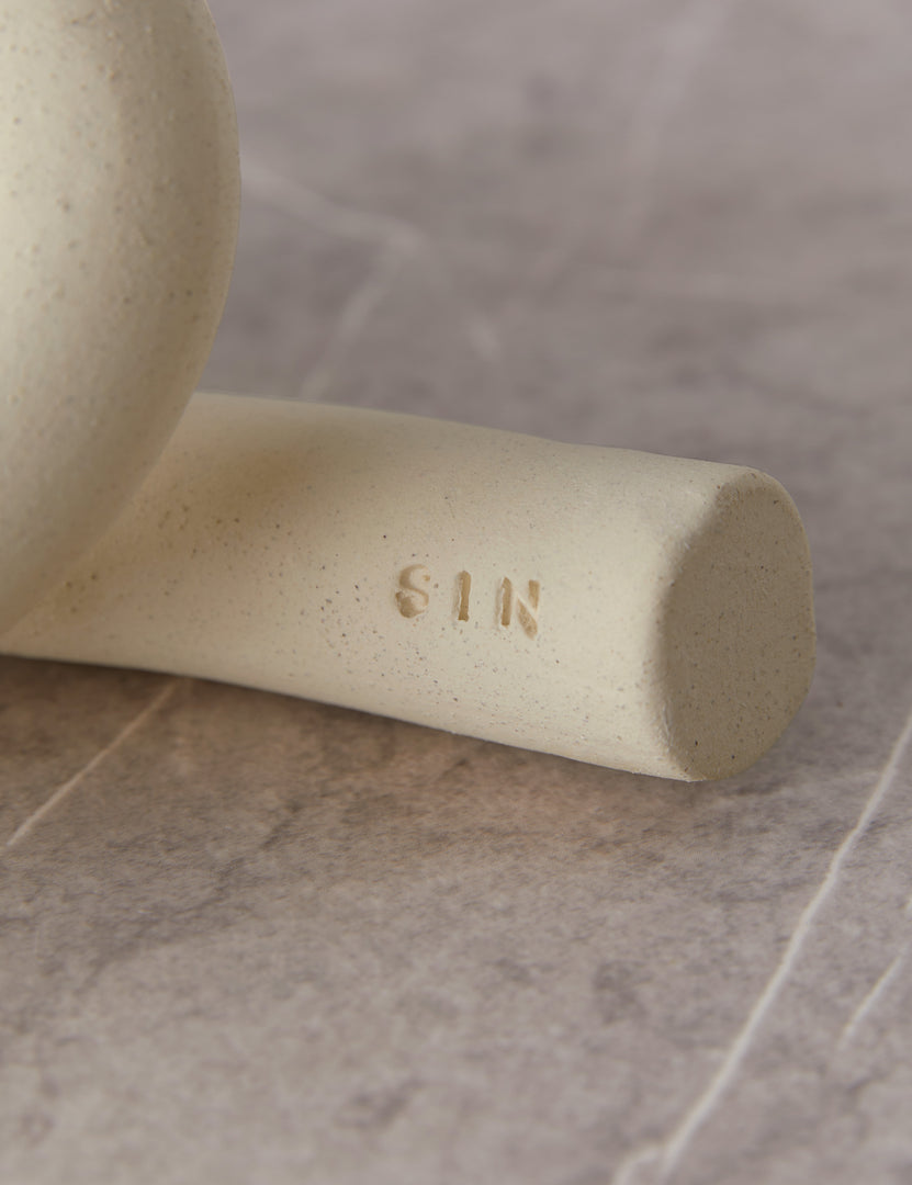 #color::white | Close up view of the decorative ceramic Ollis Knot by SIN Ceramics