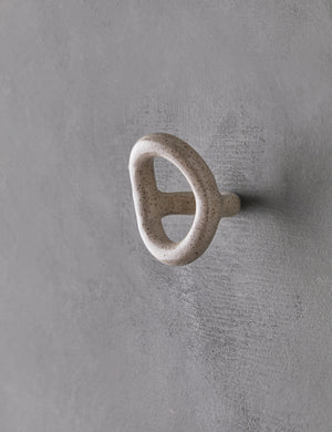 Angled view of the olo white speckled wall hook