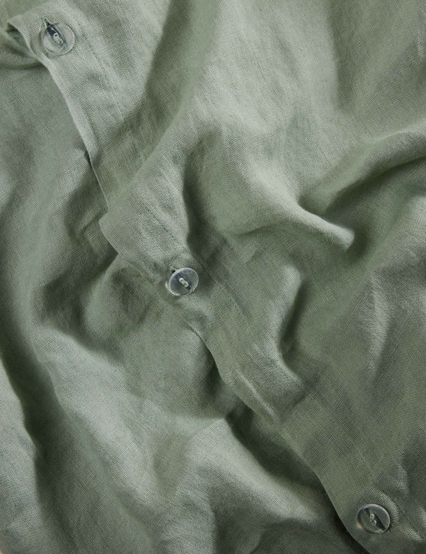 #color::lichen #size::full-queen #size::king-cal-king | Close up view of the Essie soft, breathable hemp duvet cover in lichen green