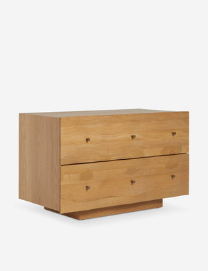 Angled view of the Otelia wide profile two drawer nightstand in natural wood