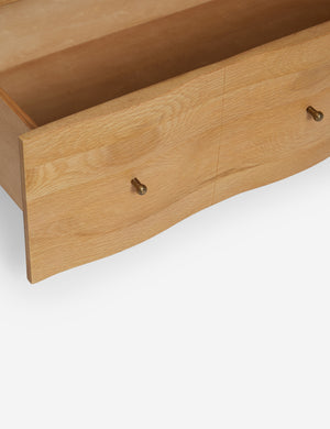 Close up of the open drawer of the Otelia wide profile two drawer nightstand in natural wood