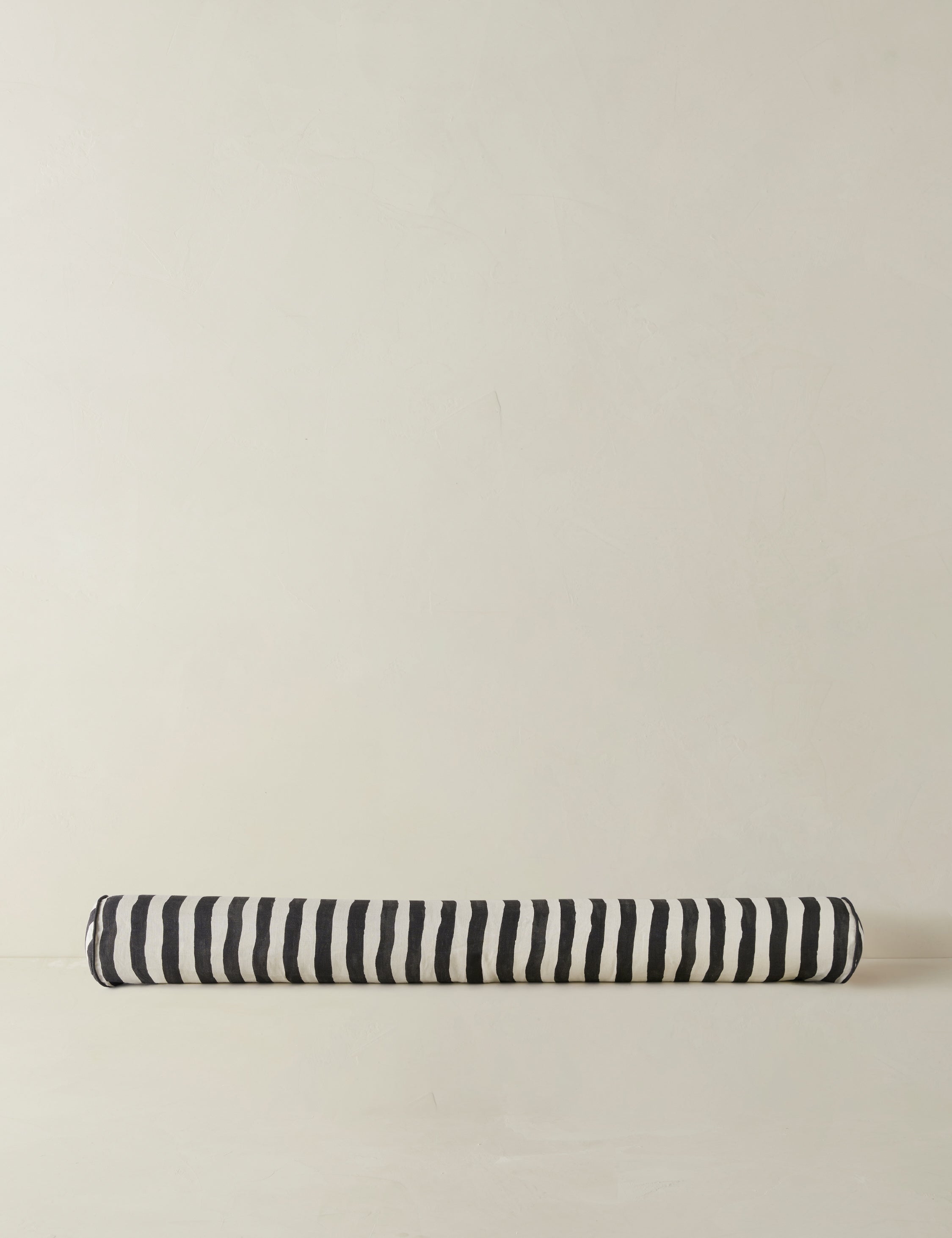 #color::black-and-ivory | Painterly stripe linen long bolster throw pillow in black and ivory