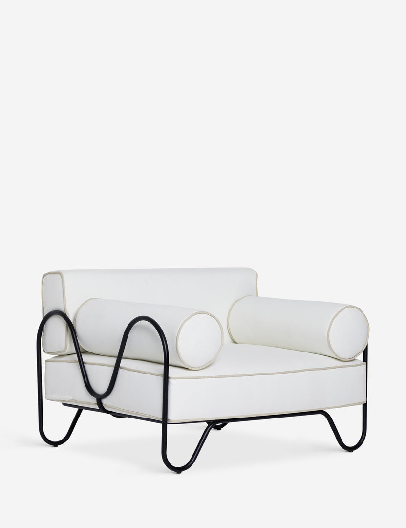 #color::ivory | Angled view of the Peggy sculptural iron frame and white cushion outdoor accent chair.