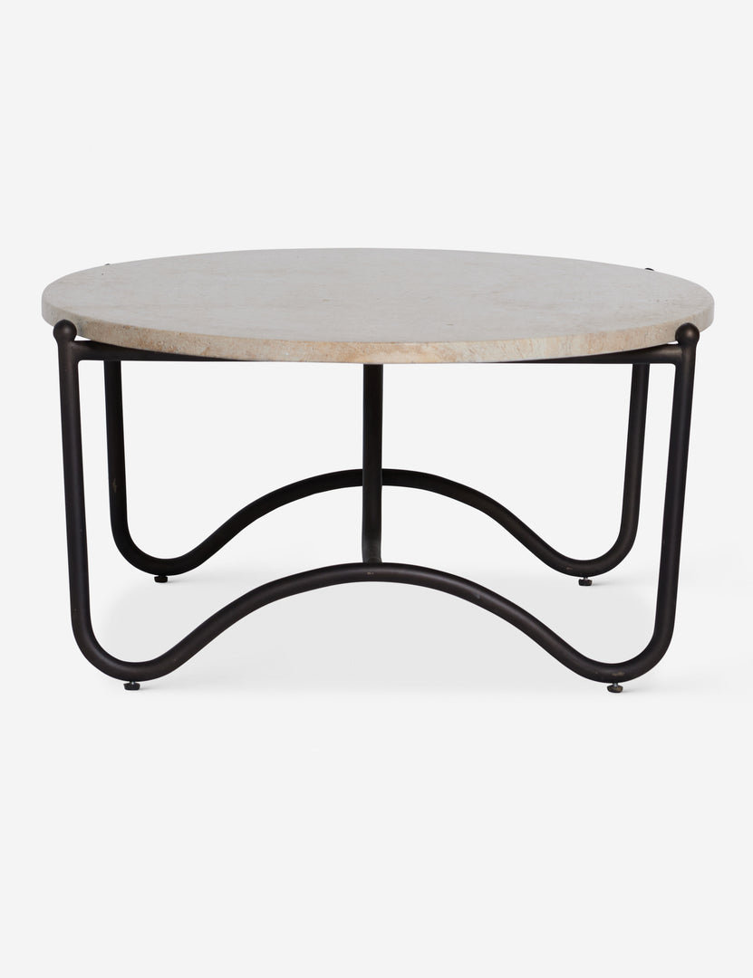 #color::faux-travertine | Side profile of the Peggy sculptural iron frame and stone top oval outdoor coffee table.