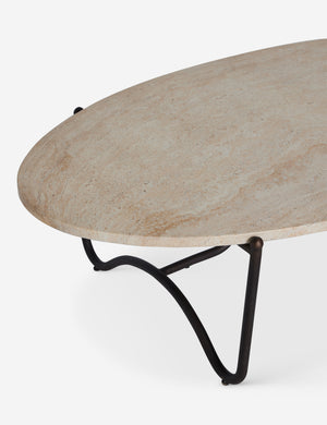 Angled overhead view of the Peggy sculptural iron frame and stone top oval outdoor coffee table.