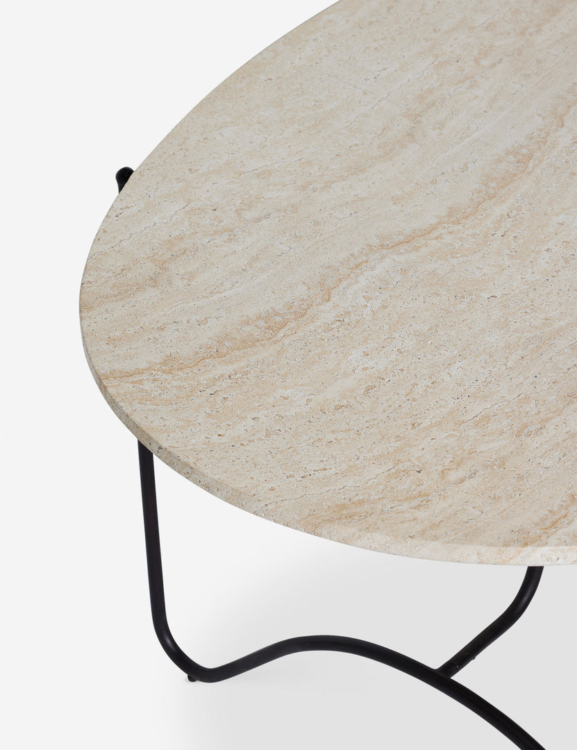 #color::faux-travertine | Angled overhead view of the top of the Peggy sculptural iron frame and stone top oval outdoor dining table.