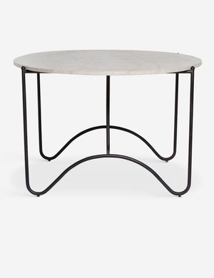 Side profile of the Peggy sculptural iron frame and stone top oval outdoor dining table.