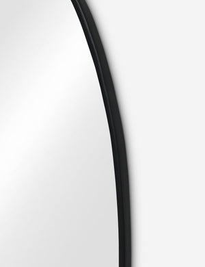 Close up view of the Puddle slim frame wall mirror in charcoal