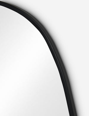 Close up view of the Puddle slim frame wall mirror in charcoal