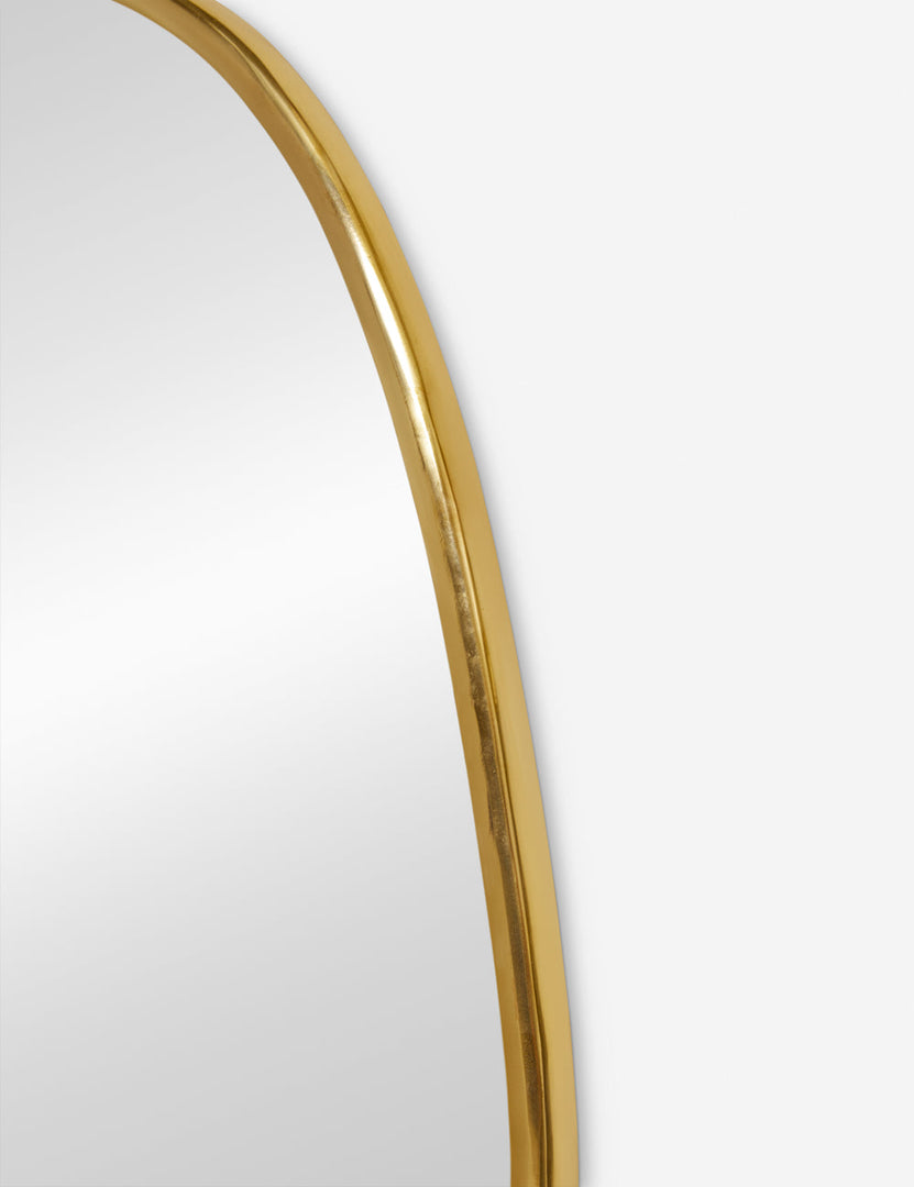 #color::gold  #size::small | The gold curved frame on the small puddle mirror