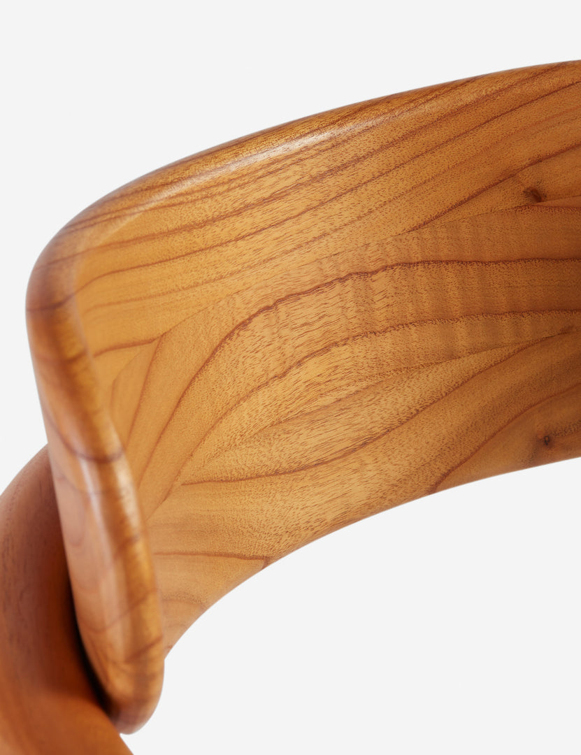 #color::natural-and-linen-weave | Close up of the wood grain of the Elvia sculptural white cedar dining chair.