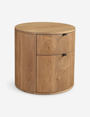 Angled view of the Kono 2-drawer round oak nightstand.