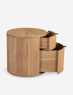 Side view of the Kono 2-drawer round oak nightstand with both drawers slightly opened.