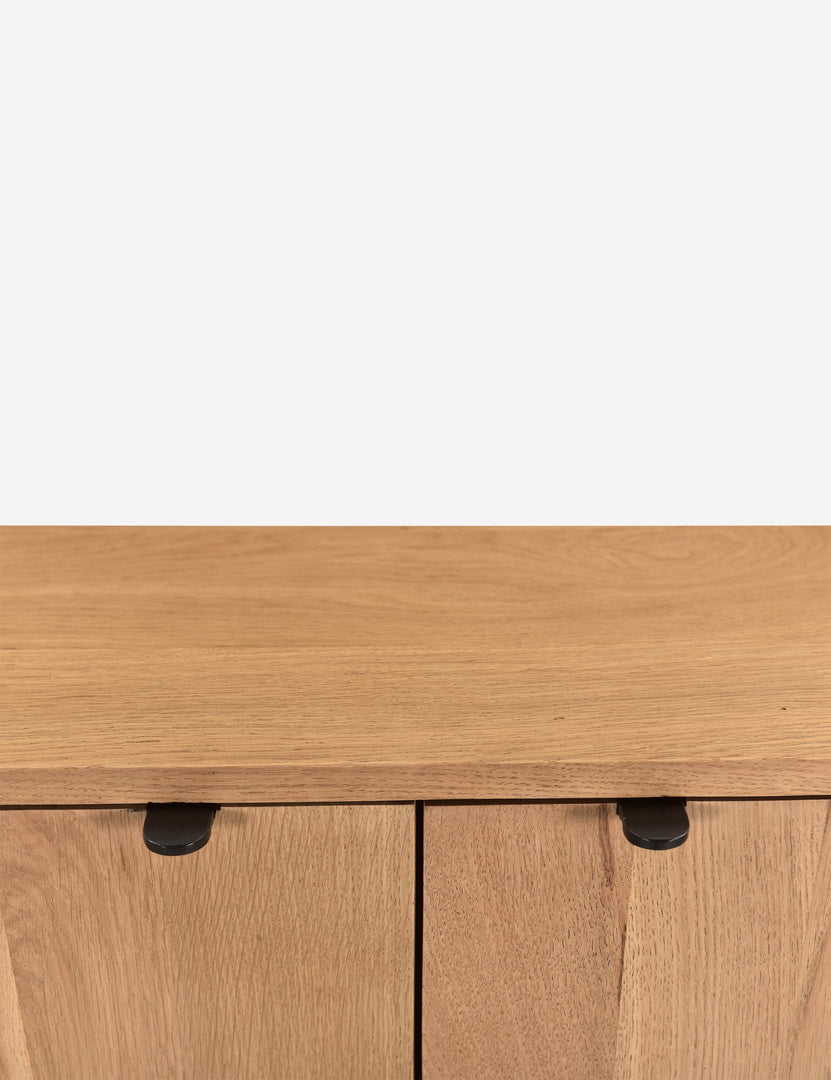 | Close up of the handles of the Kono 2-door curved oak cabinet.